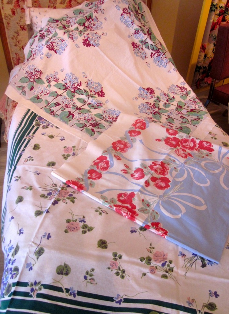 Lovely vintage tablecloths. A few tiny holes. No stains. Terrific for picnics. $20 each.