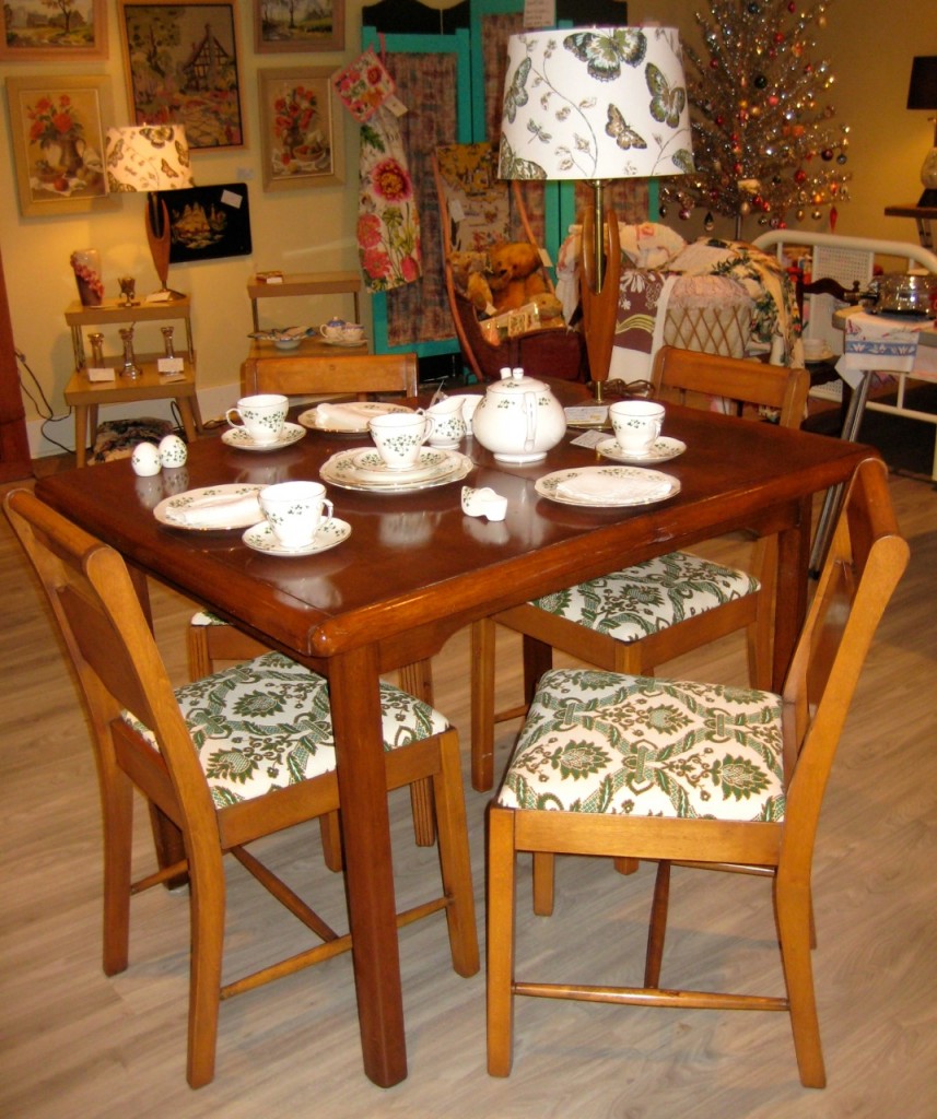 The complete hardwood dining set. 4 chairs with linen seat covers and the table. $425
