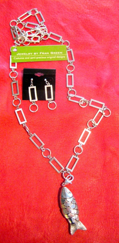 Silve-plated rectangle and circle link chain. ($95) Can be worn long or short with or without the fish pendant. Matching earrings ($35)