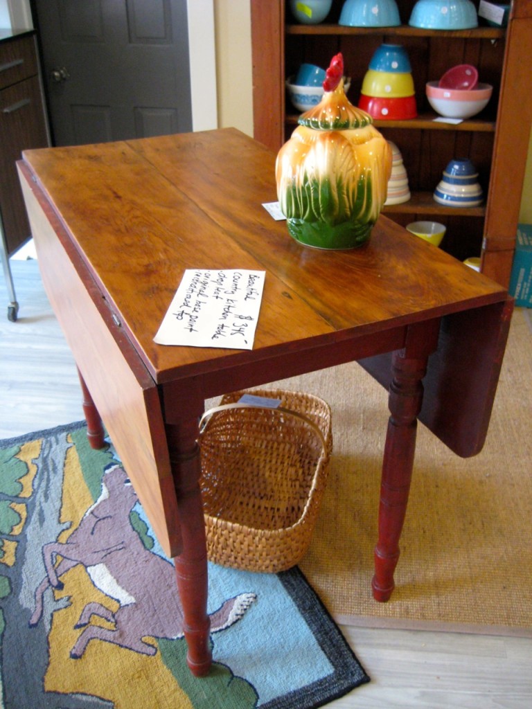 Drop-leaf table viewed from the side. $345